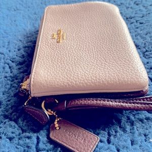Like new COACH double zip corner wristlet  Mauve and cranberry color.